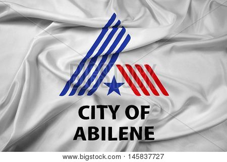 Waving Flag of Abilene Texas USA, with beautiful satin background.