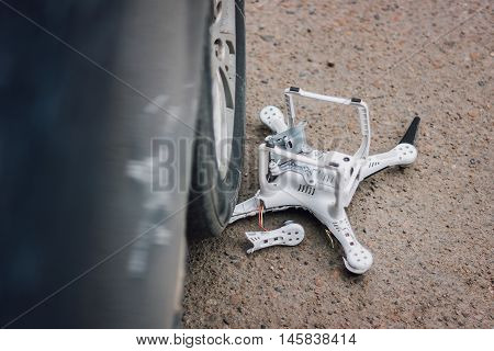 Crashed quadcopter after an accident laying on the ground