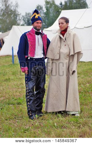 BORODINO MOSCOW REGION - SEPTEMBER 04 2016: Reenactors man and woman at Borodino battle historical reenactment in Russia. Color photo.