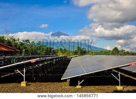 Bali, Indonesia - June 26, 2013: Solar PV with mountain in the background in Bali, Indonesia.