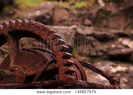 Rusted iron wheal at the coastline in the Faroe Islands
