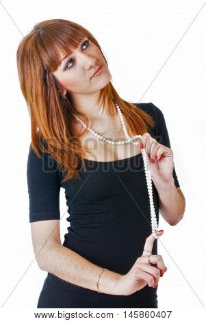 Portrait of attractive young red-haired woman with beads. Isolated over white background