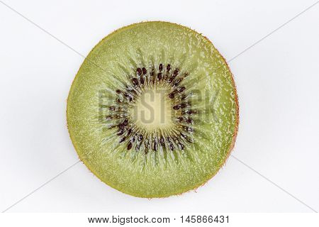 Cross section of kiwi isolated on white background.