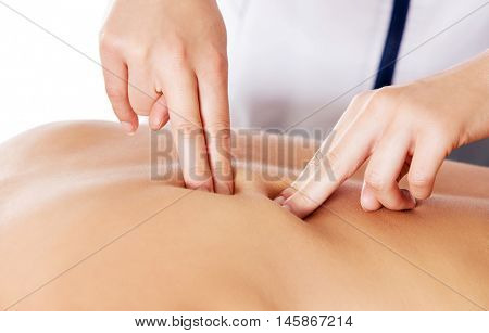 Woman having massage of body in the spa salon. Beauty treatment concept.