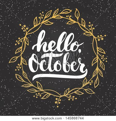 Hand drawn typography lettering phrase Hello, October with golden wreath on the chalkboard background. Fun brush inscription for photo overlays, greeting and invitation card or t-shirt print design.