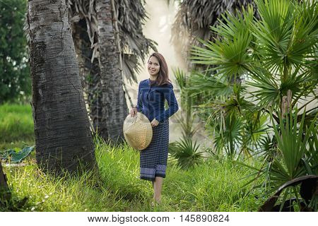 Thai Farmer Woman Wearing Typical Thai Dress, On Rice Fields Background, Identity Culture Of Thailan
