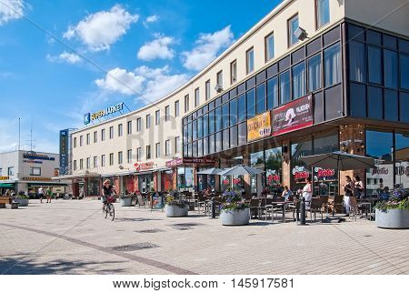 IMATRA, FINLAND - JULY 2, 2016: People in bistro near Center Hotel Imatra on Koskenparras