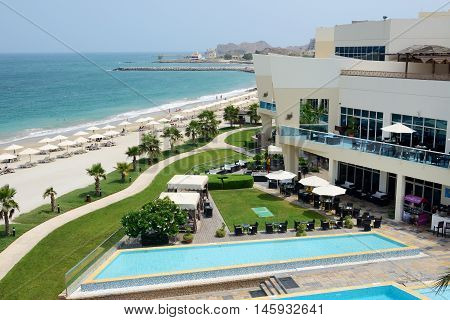 FUJAIRAH UAE - SEPTEMBER 7: The tourists enjoying their vacation at luxury hotel on September 7 2013 Fujairah UAE. Up to 10 million tourists have visited UAE in year 2013.
