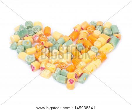 Hard home made all natural candies hearth shape on white background