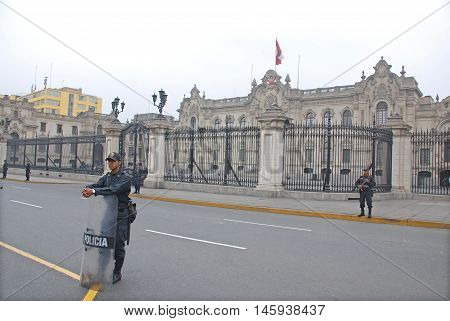 LIMA PERU NOV. 24 2009: Police in front the Government palace at Plaza de Armas, Peru.Is the birthplace of the city of Lima, as well as the core of the city. Located in the Historic Centre of Lima.