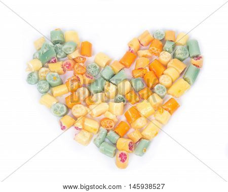 Hard home made all natural candies hearth shape on white background