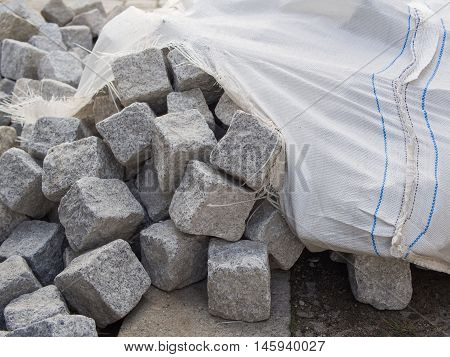 Pile Of Cobblestones With A Cracked Cotton Sack