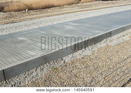 New concrete road barriers the metal mesh