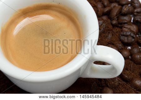 Cup of coffee closeup, grai and roasted