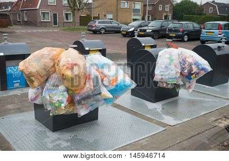 OLDENZAAL NETHERLANDS - JANUARY 1 2016: plastic bags with recyclable waste at a waste collection point