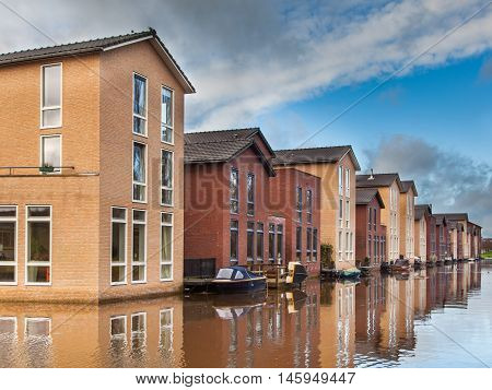 Modern Middle Class Houses Along A Canal