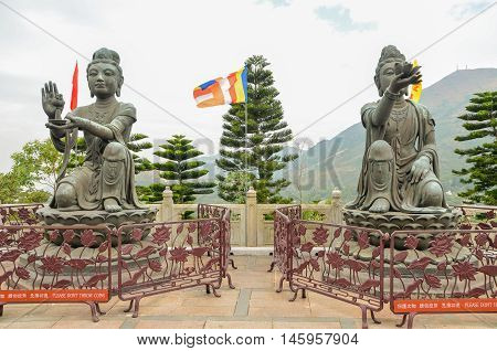 HONG KONGHONG KONG - December 8 2013:two of the Six Devas praising and making offerings to the Tian Tan Buddha.