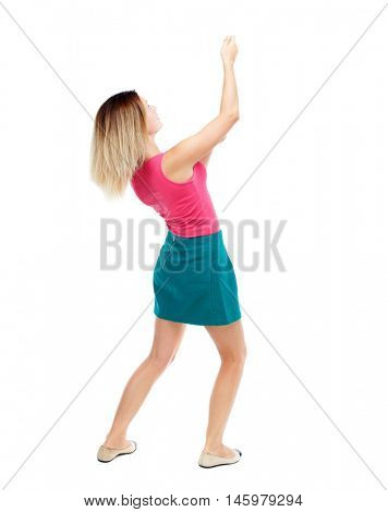 back view of standing girl pulling a rope from the top or cling to something. Isolated over white background. Blonde in a red sweater and green skirt drawn above.