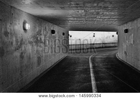Dark passage underground in cement, concrete for pedestrian walkers and cyclists, taken in Baden, Switzerland