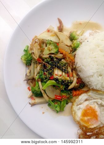 Stir-fried Black Pepper With Colorful Vegetables & Thai Jasmine Rice & Fried Egg In White Dish Isola