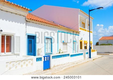 Street with typical  Portuguese white houses in Sagres,  the municipality of Vila do Bispo,  southern Algarve of Portugal.