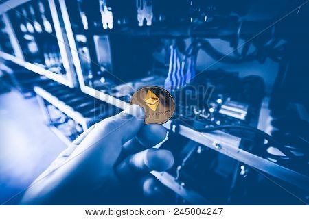Cryptocurrency Mining Concept Closeup With Golden Etherium