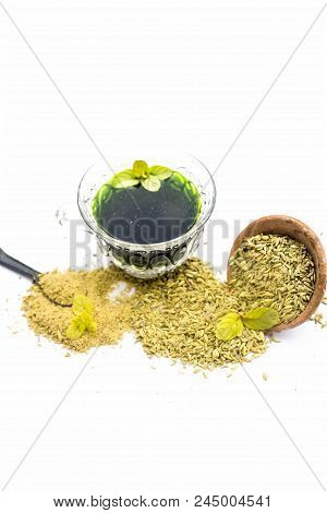 Raw Fennel With Its Powder And Its Beneficial Tea Or Extract In A Transparent Cup Isolated On White.