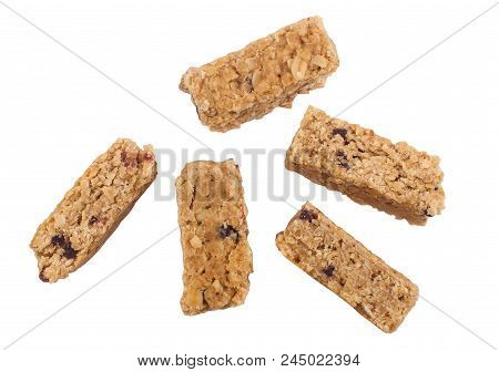 Top View Closeup Of Five Cereal Granola Bar With Nuts And Fruit Berries Isolated On White Background