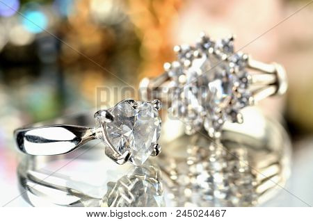Close-up Of Silver Ring With Artificial Stone And Another Ring In Background - Jewelery, Warm Color 