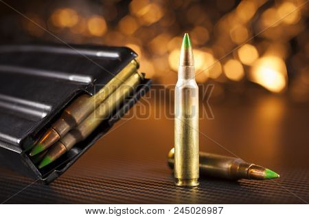 M855 Ammo And Magazine For An Assault Rifle With Orange Behind