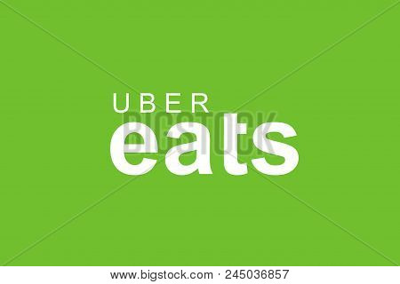 Portugal, Lisbon June 13, 2018: Illustration Of The Uber Eats Logo On A Green Background. A Popular 