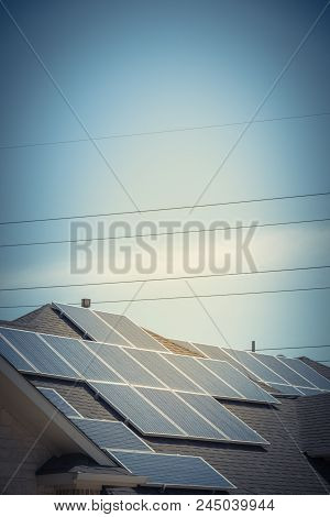 Solar Panel Installation On Asphalt Shingles Rooftop