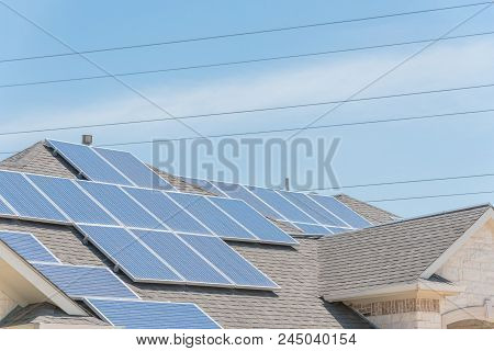 Solar Panel Installation On Asphalt Shingles Rooftop