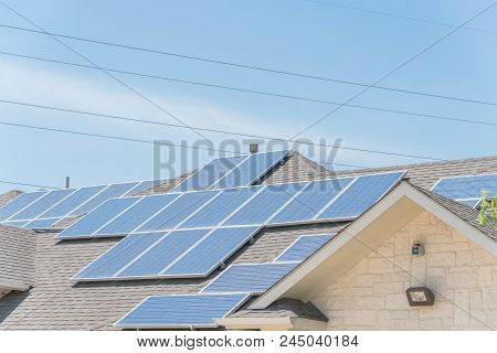 Solar Panel Installation On Asphalt Shingles Rooftop