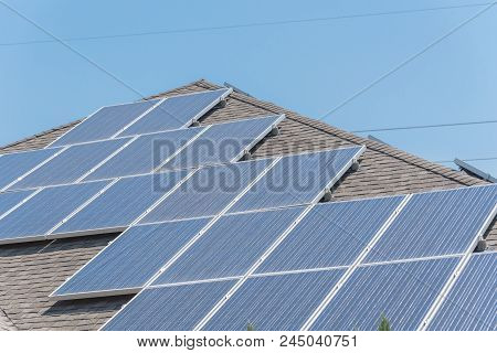 Solar Panel Installation On Asphalt Shingles Rooftop