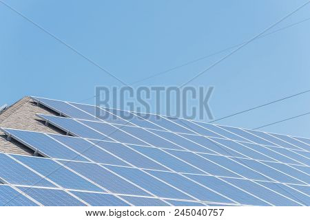 Solar Panel Installation On Asphalt Shingles Rooftop