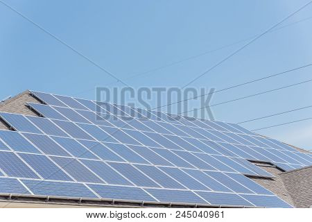 Solar Panel Installation On Asphalt Shingles Rooftop