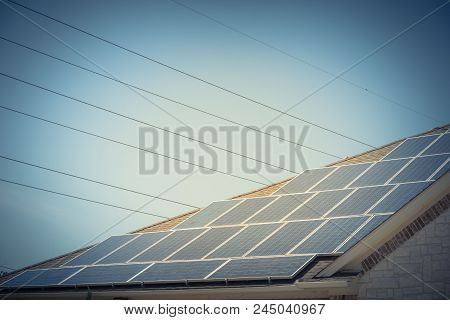 Solar Panel Installation On Asphalt Shingles Rooftop