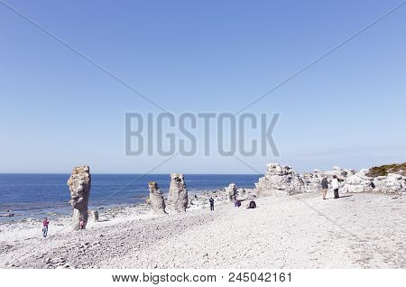 Faro, Sweden - May 13, 2016: People At The Sea Stacks Located At Langshammars In The Swedish Provinc