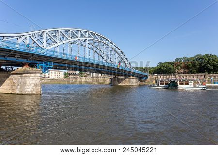 KRAKOW, POLAND - JUNE 9, 2018. Jozef Pilsudski Bridge over Wisla River in Krakow.