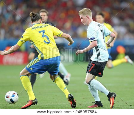 Nice, France - June 22, 2016: Kevin De Bruyne Of Belgium (r) Fights For A Ball With Erik Johansson O