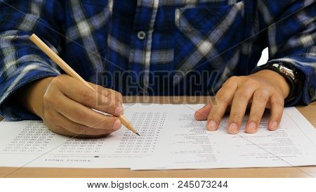 English Grammar Test And Answer Sheet On Table