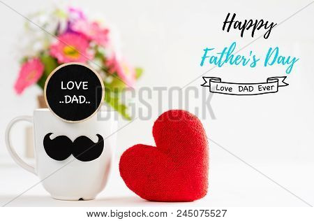 Happy Fathers Day Concept. Handmane Red Heart With Mustache And Wooden Tag With Love Dad Text On Cof