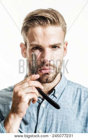 Beauty Industry And Home Skin Care Concept. Bearded Man Having Shave With Razor Blade. Portrait Of M