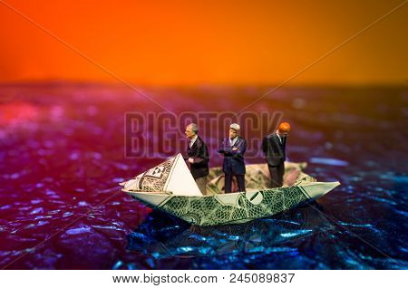 Miniature Figurine Businessmen Ride On Dollar Bill Origami Yacht
