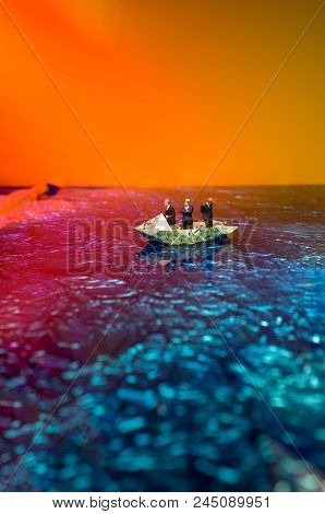 Miniature Figurine Businessmen Ride On Dollar Bill Origami Yacht