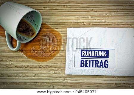 Letter With In German Rundfunkbeitrag In English Radio Post And A Dumped Coffee Cup From Fright