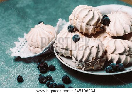 Pink Marshmallows With Blueberries On White Plate.
