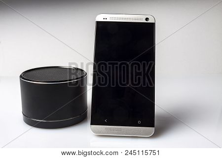 The Phone With A Portable Calorimeter On A White Background Is Not Insulated.