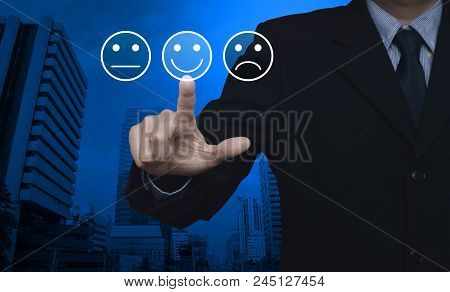 Businessman Pressing Excellent Smiley Face Rating Icon Over Modern Office City Tower, Business Custo
